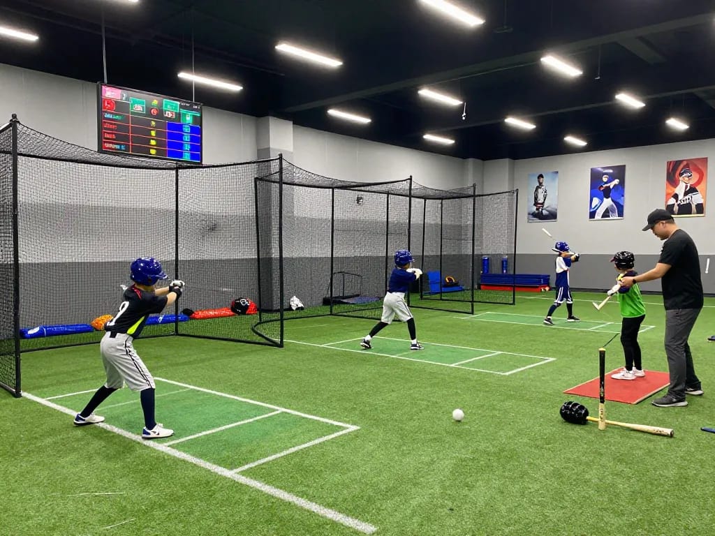 Hitclub baseball training facility with athletes enhancing their hitting skills in a vibrant indoor environment.